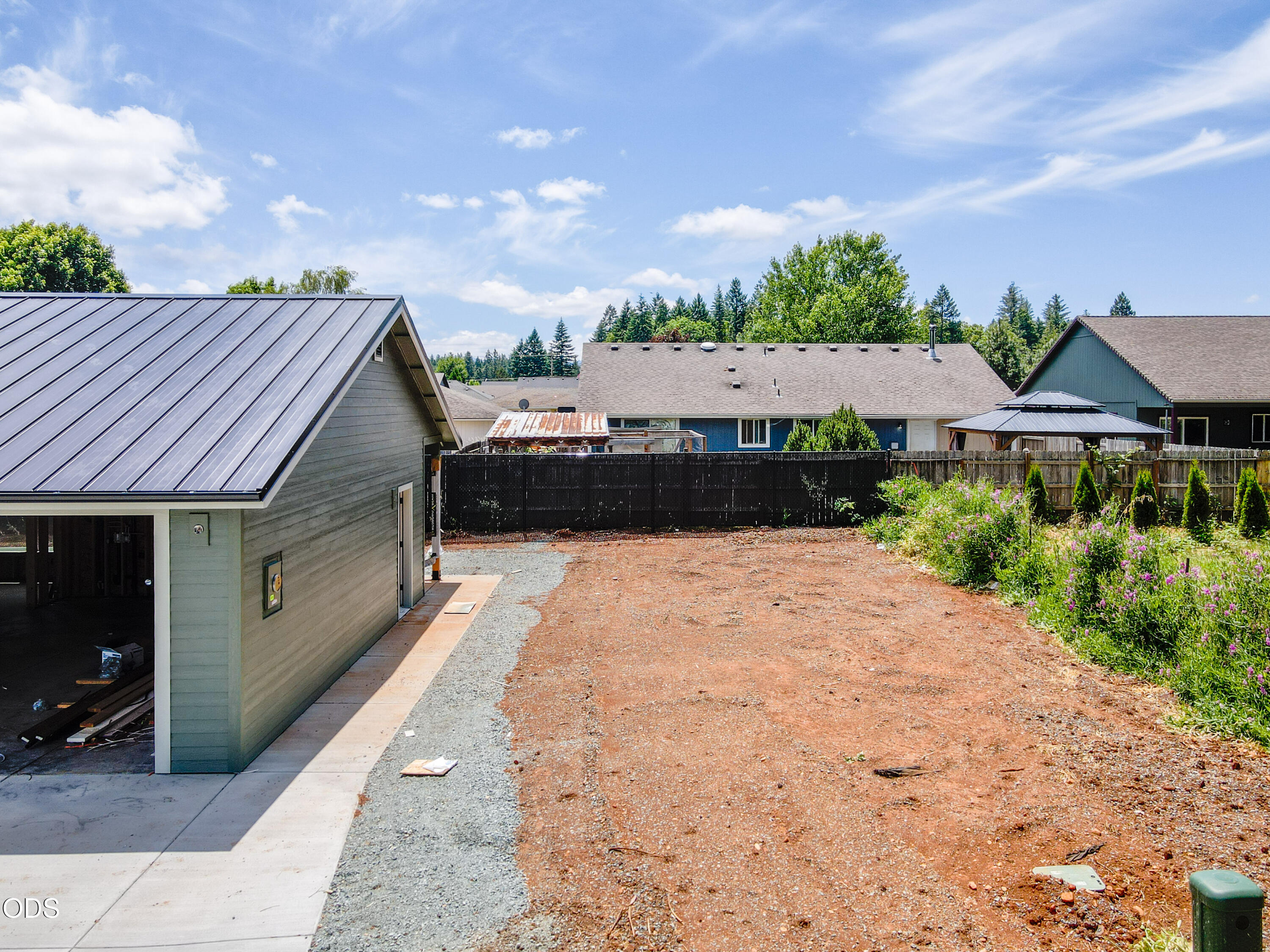 405 Cece Lane Cave Junction, OR 97523 - Photo 5 of 15 a backyard of a house with lots of green space