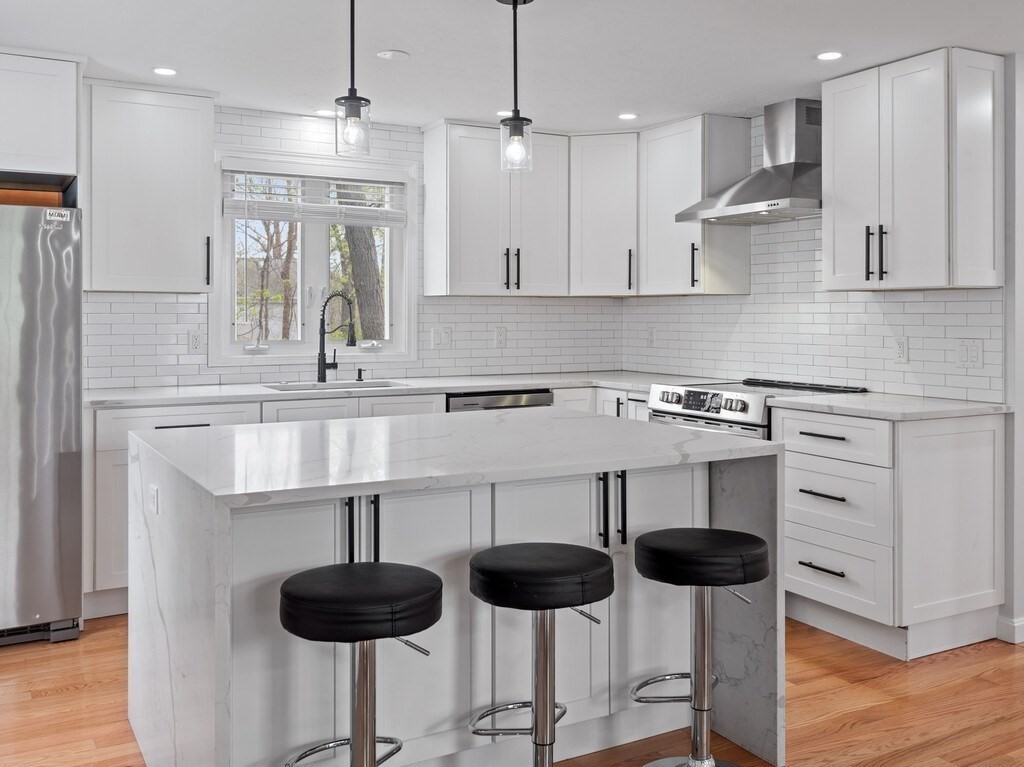 2 Stringer Dam Road Shrewsbury, MA 01545 - Photo 11 of 35 a kitchen with stainless steel appliances granite countertop a stove a sink and a refrigerator