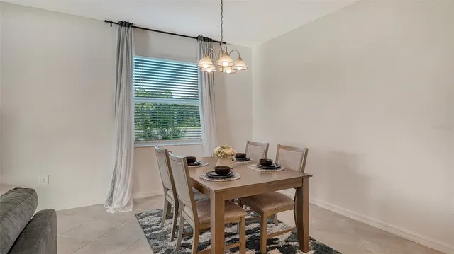 a kitchen with a refrigerator and cabinets