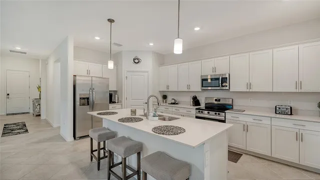 a bathroom with a double vanity sink and mirror