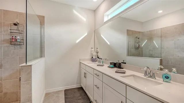 a bathroom with a bathtub and shower