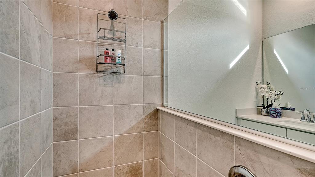 10896 Pinot Drive Venice, FL 34293 - Photo 23 of 70 a bathroom with a bathtub and shower