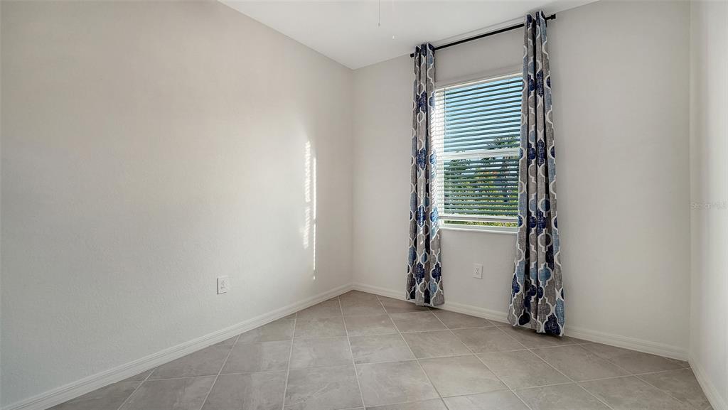 10896 Pinot Drive Venice, FL 34293 - Photo 24 of 70 a view of an empty room with a window