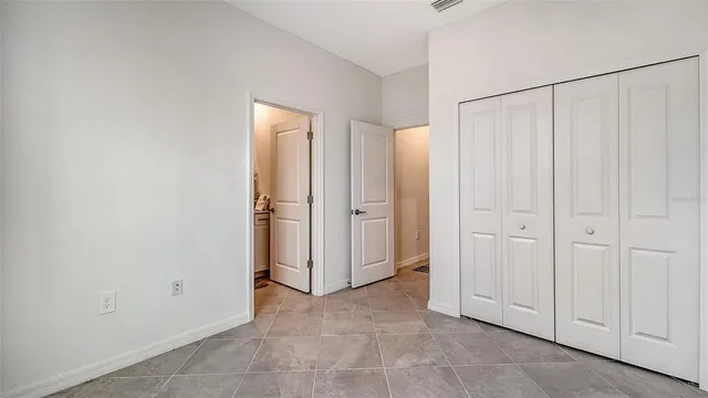 a view of a lake with houses in the back