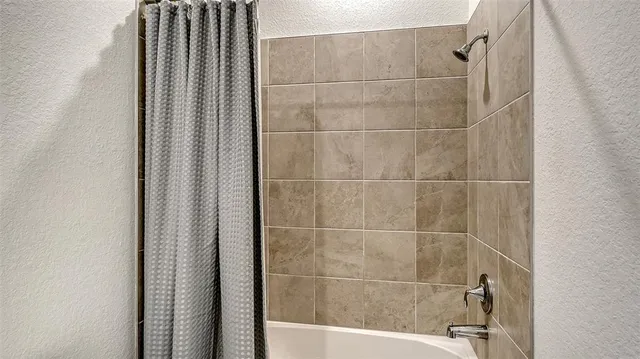 a view of a livingroom with furniture and a window