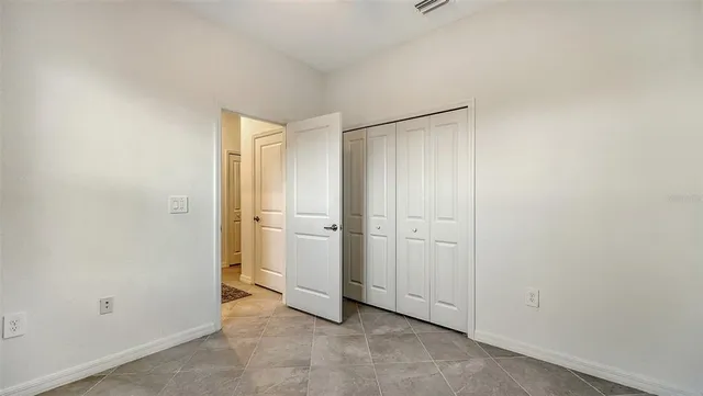 a building outdoor space with patio furniture and potted plants