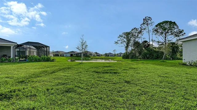 a front view of house with a garden