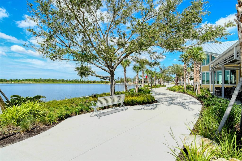 10896 Pinot Drive Venice, FL 34293 - Photo 50 of 70 a view of a garden with a lake