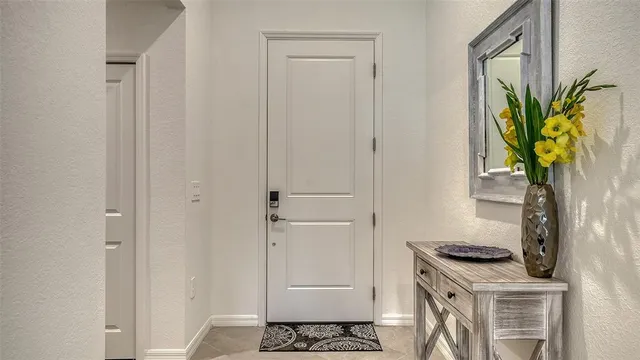 a living room with furniture a flat screen tv and a large window
