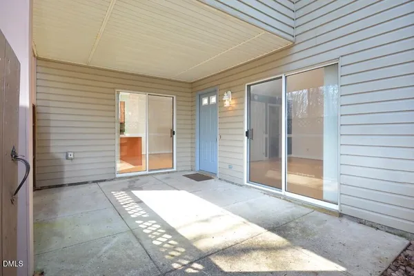 a view of backyard with large windows