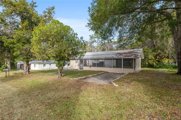 a view of a house with a yard
