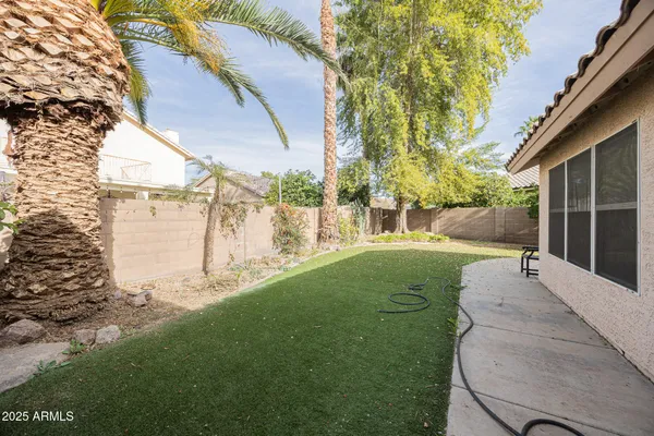 a view of a small house with a patio