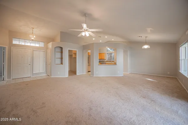 a view of a kitchen with kitchen island a sink dishwasher and a refrigerator