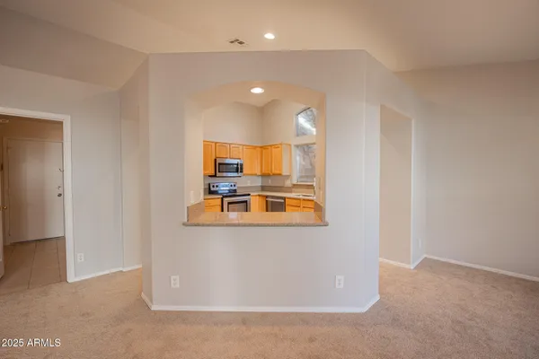 a view of an empty room with a window