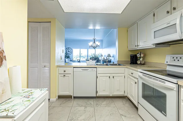 a living room with furniture and a wall painting