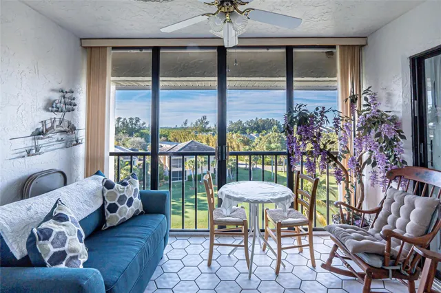 a bedroom with a large bed and a large window