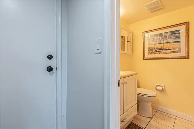 a en suite bathroom with a tub double vanity and mirrors