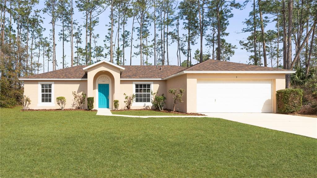 3 Richelieu Lane Palm Coast, FL 32164 - Photo 1 of 1 a front view of a house with a yard