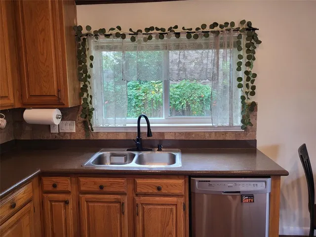 a kitchen with a sink and cabinets