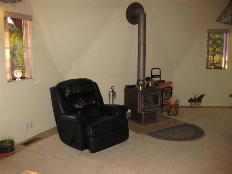 2363 Old Ferry Road Shady Cove, OR 97539 - Photo 8 of 31 a living room with furniture and a lamp