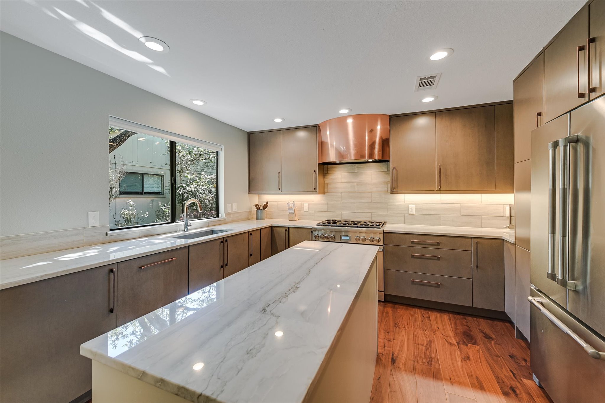 8121 Raintree Place Austin, TX 78759 - Photo 1 of 1 Beautifully updated kitchen showcases high-end finishes throughout