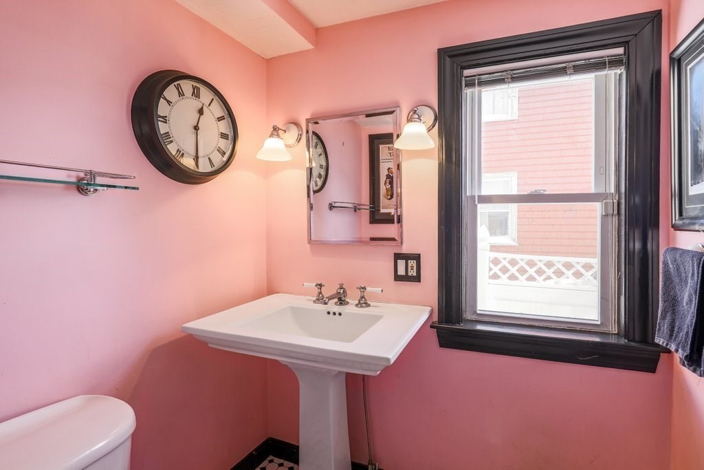 33 Montrose Street Everett, MA 02149 - Photo 11 of 36 a bathroom with a toilet a sink and a mirror