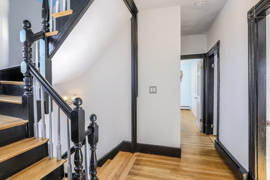 33 Montrose Street Everett, MA 02149 - Photo 13 of 36 a view of hallway with wooden floor and stairs