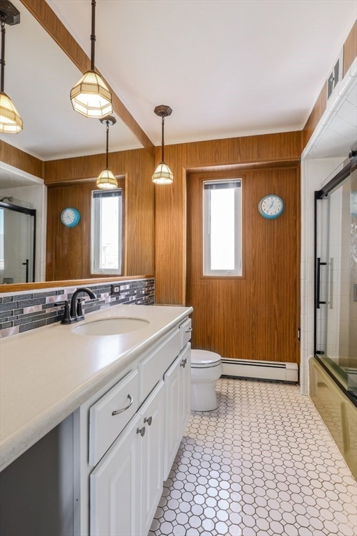 33 Montrose Street Everett, MA 02149 - Photo 15 of 36 a bathroom with a sink a toilet and a mirror
