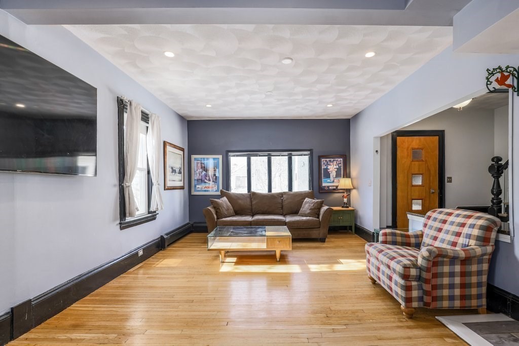 33 Montrose Street Everett, MA 02149 - Photo 2 of 36 a living room with furniture and a large window