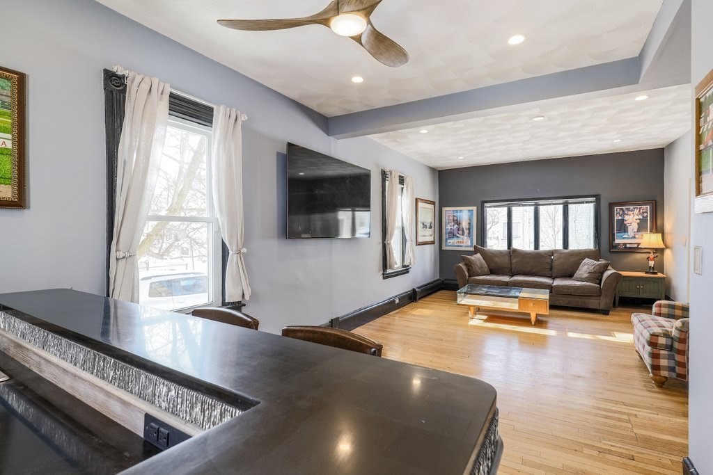 33 Montrose Street Everett, MA 02149 - Photo 6 of 36 a living room with furniture and a flat screen tv