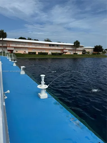 a view of swimming pool with outdoor seating