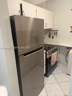 a close view of a sink and a stove in a kitchen