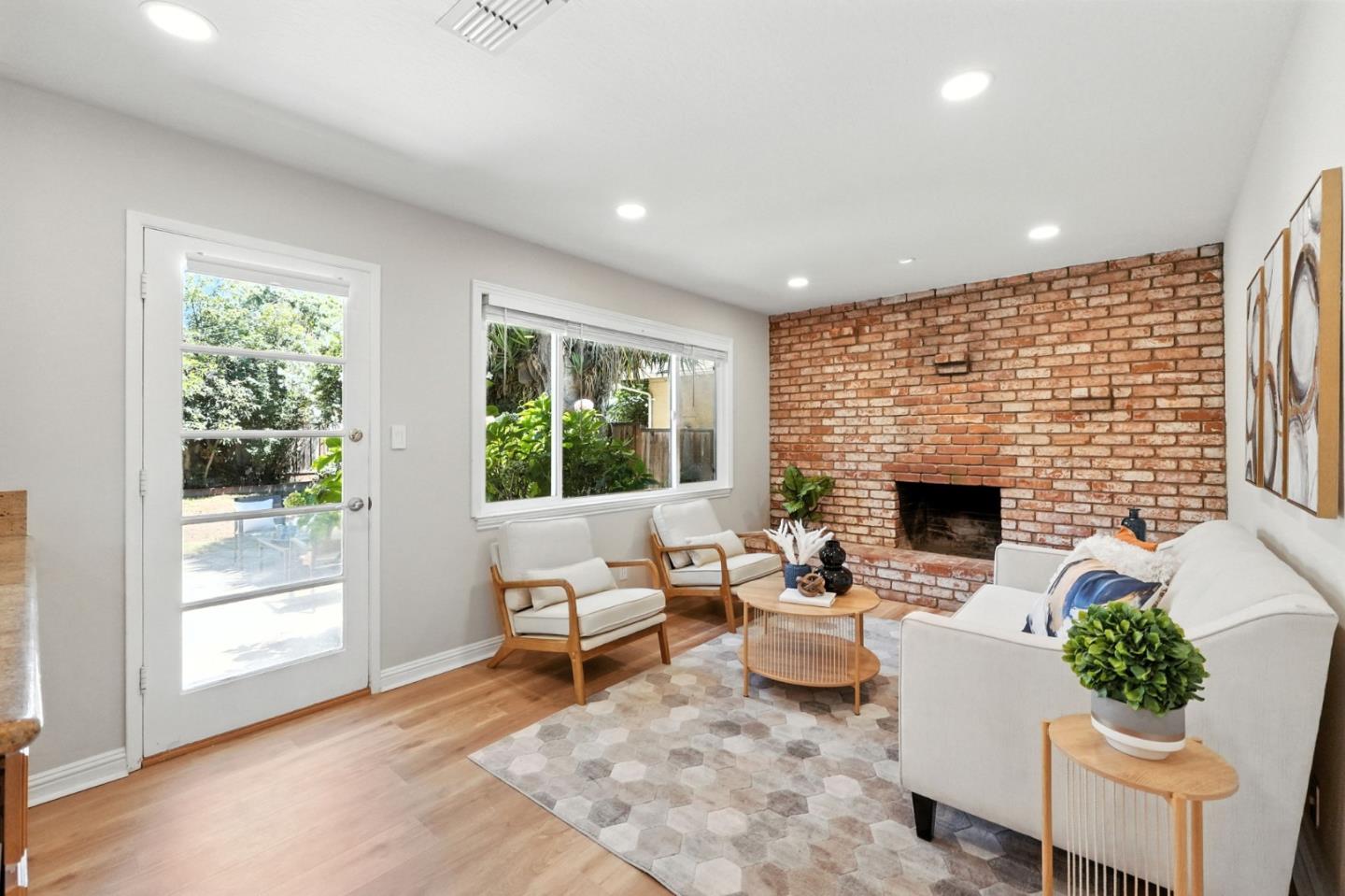 479 Chestnut Avenue Milpitas, CA 95035 - Photo 16 of 27 a living room with furniture a fireplace and a floor to ceiling window