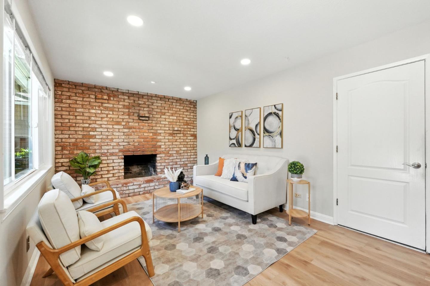 479 Chestnut Avenue Milpitas, CA 95035 - Photo 17 of 27 a living room with furniture and a fireplace