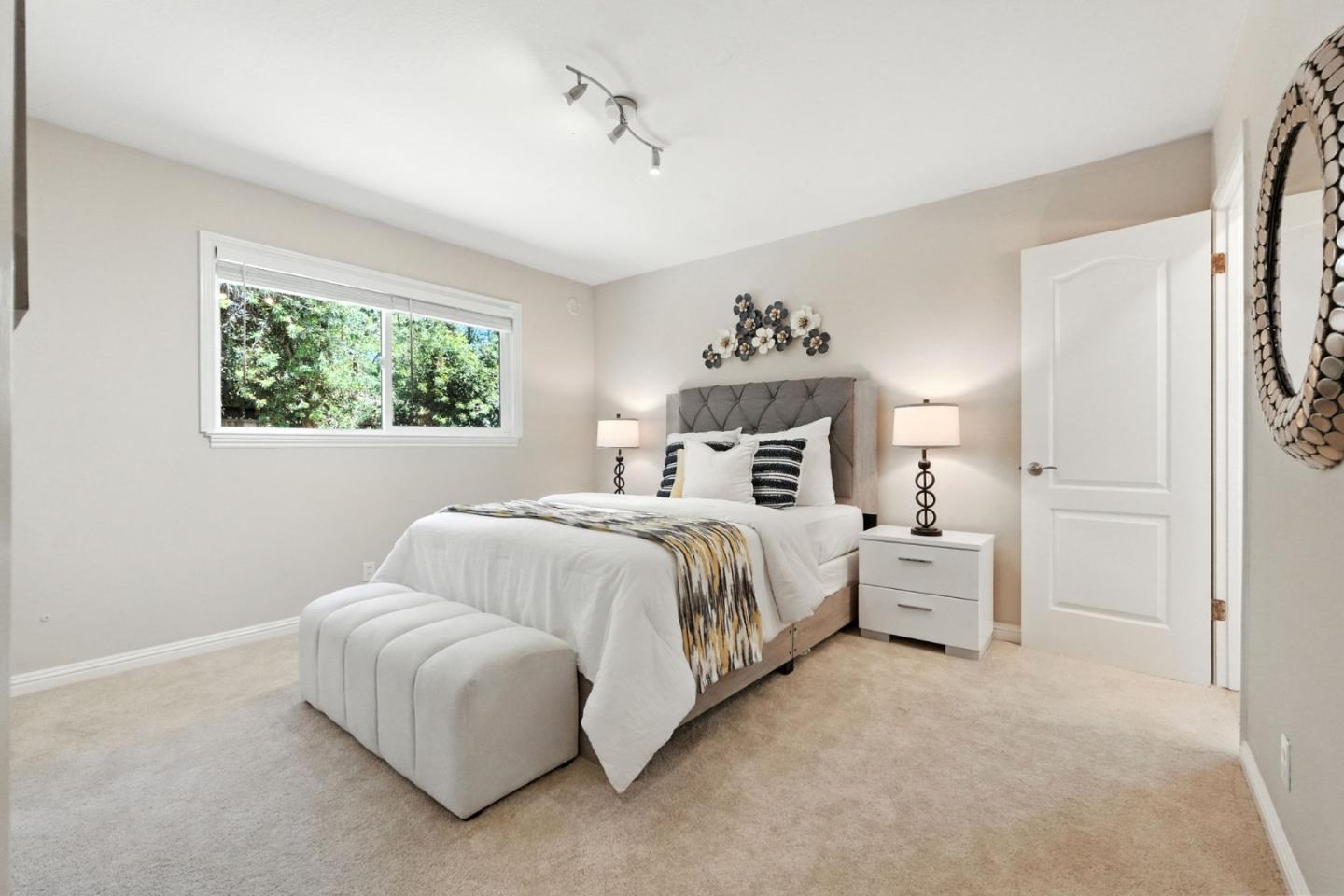 479 Chestnut Avenue Milpitas, CA 95035 - Photo 19 of 27 a bed room with a bed and a painting on the wall