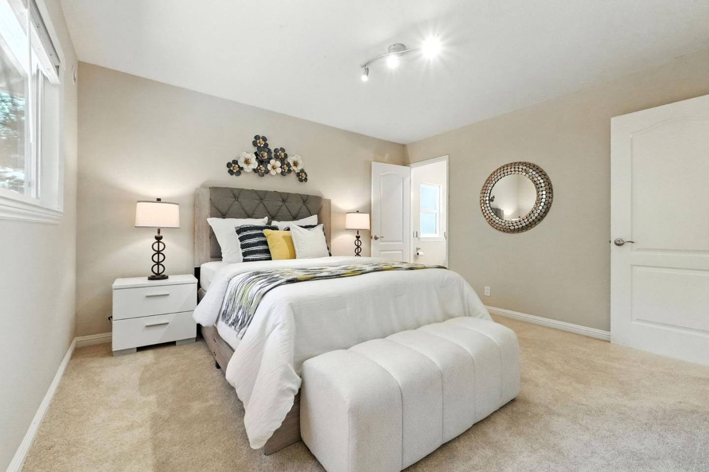 479 Chestnut Avenue Milpitas, CA 95035 - Photo 20 of 27 a bedroom with a bed and a chandelier