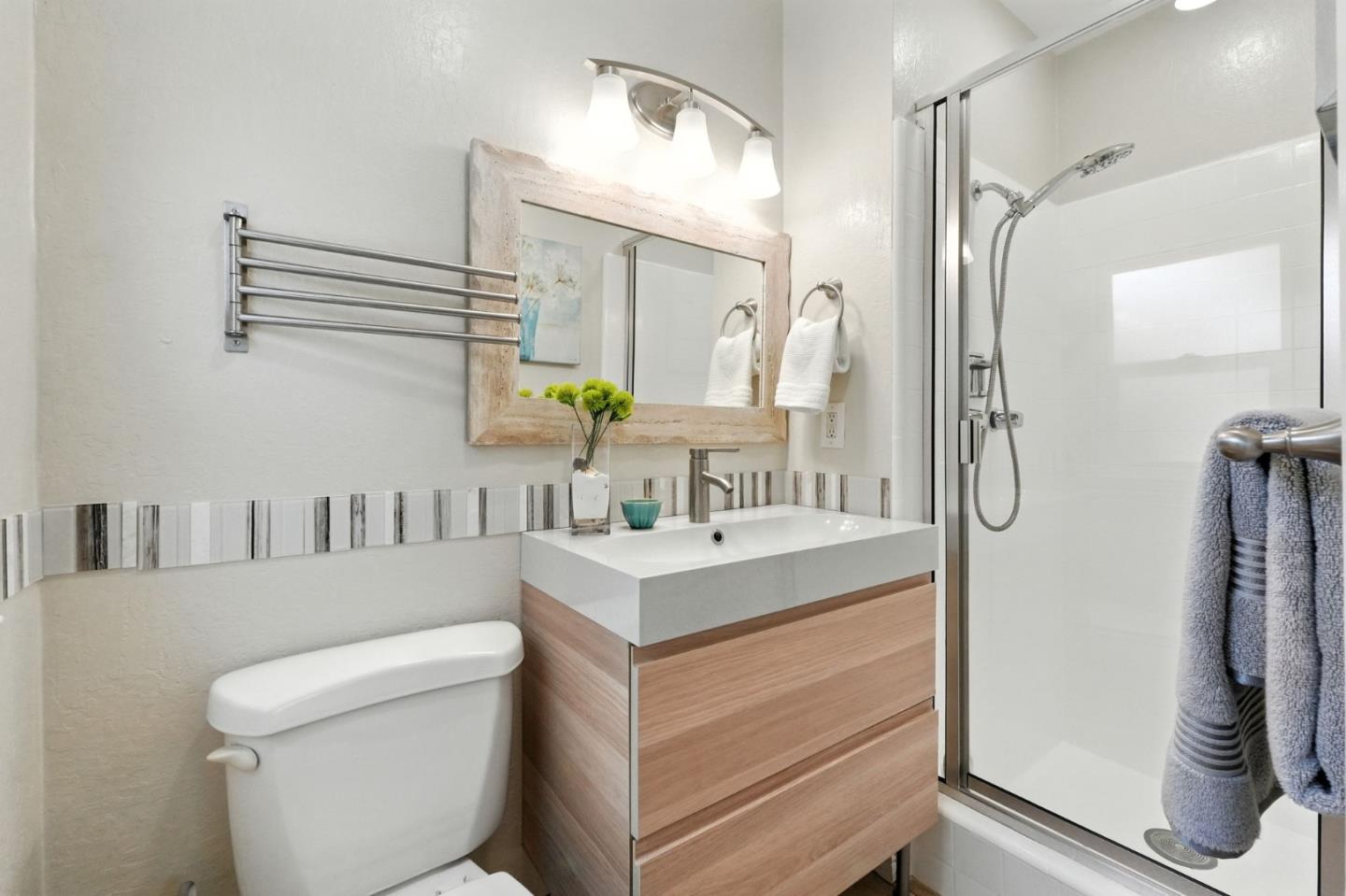 479 Chestnut Avenue Milpitas, CA 95035 - Photo 21 of 27 a bathroom with a sink a toilet and shower
