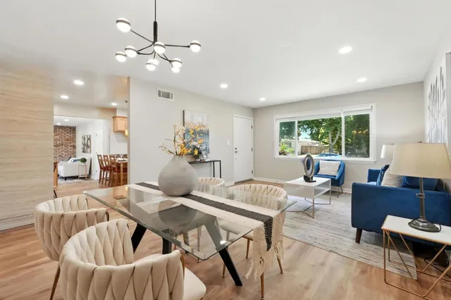 a living room with furniture and a table