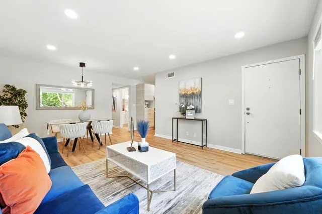 a living room with furniture and a large window