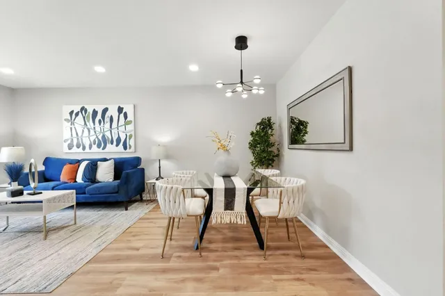 a view of kitchen with cabinets and wooden floor