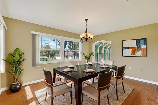 a kitchen with stainless steel appliances granite countertop a refrigerator a sink and a stove