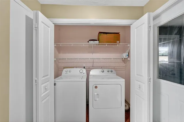 a bathroom with a shower a toilet and a sink