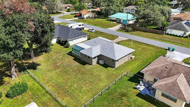 an aerial view of a house with a garden