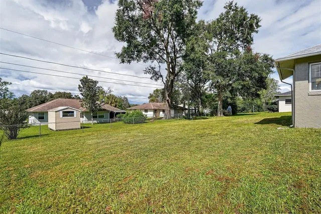 a front view of a house with garden and porch