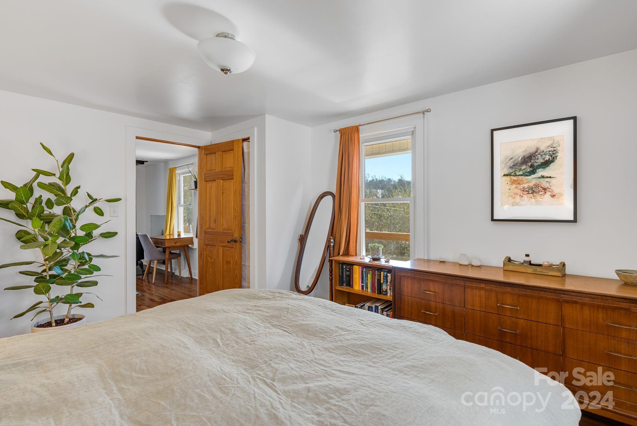 608 Barnard Road Marshall, NC 28753 - Photo 12 of 23 a bed room with a bed and a large window