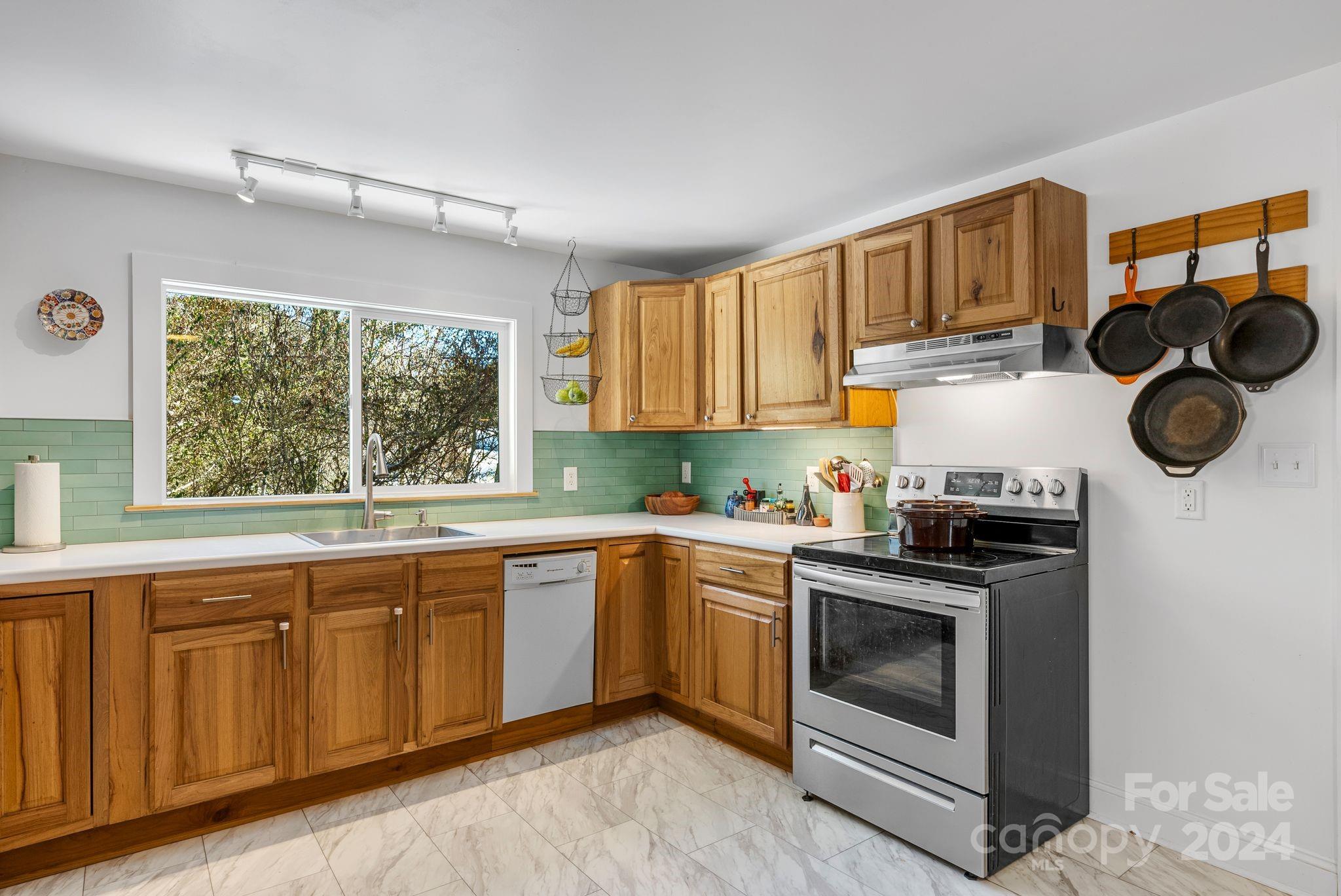 608 Barnard Road Marshall, NC 28753 - Photo 9 of 23 a kitchen with a stove and a sink