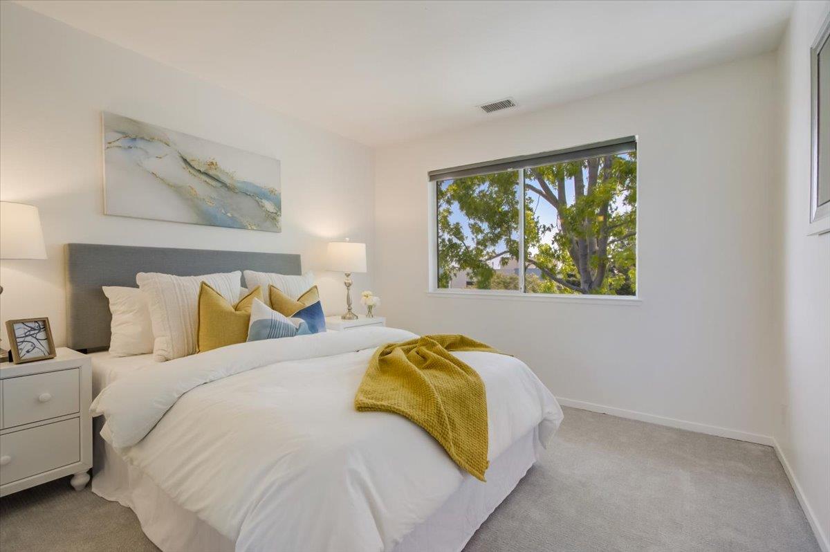 300 Murchison Drive, Unit 311 Millbrae, CA 94030 - Photo 12 of 25 a bedroom with a bed and a window