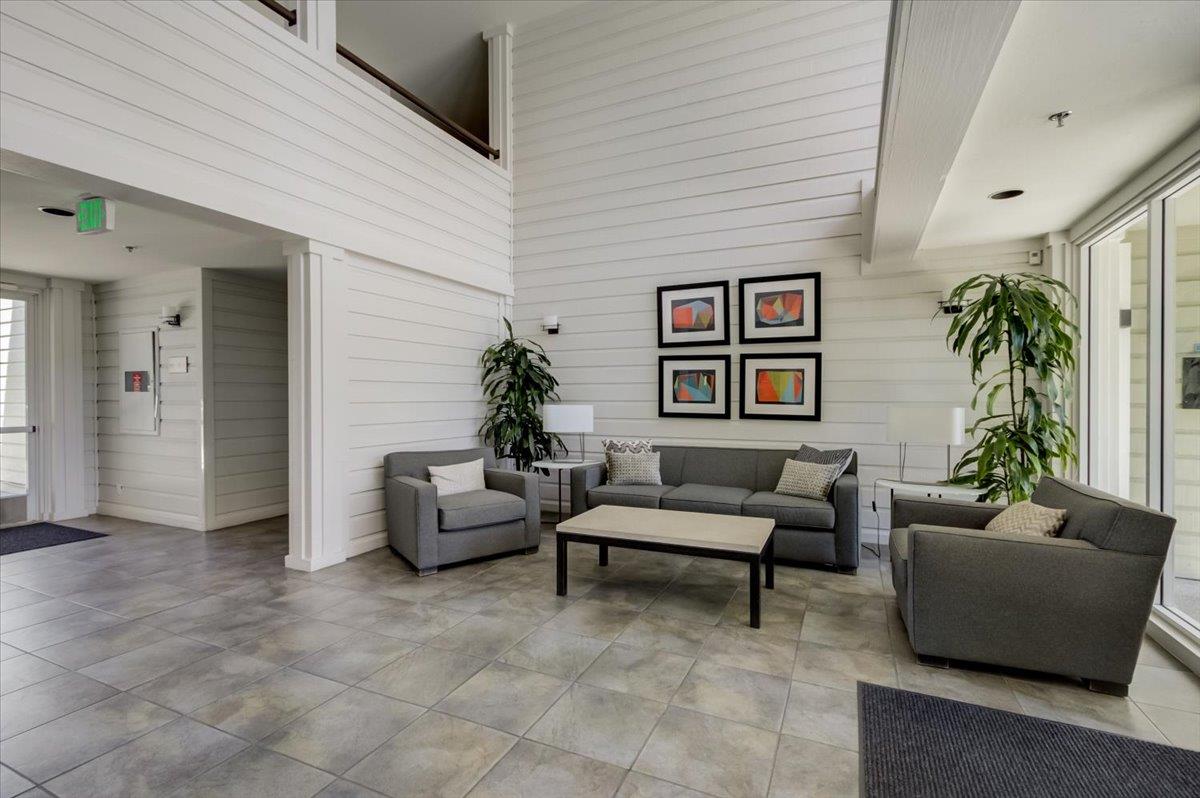 300 Murchison Drive, Unit 311 Millbrae, CA 94030 - Photo 16 of 25 a living room with furniture and a potted plant