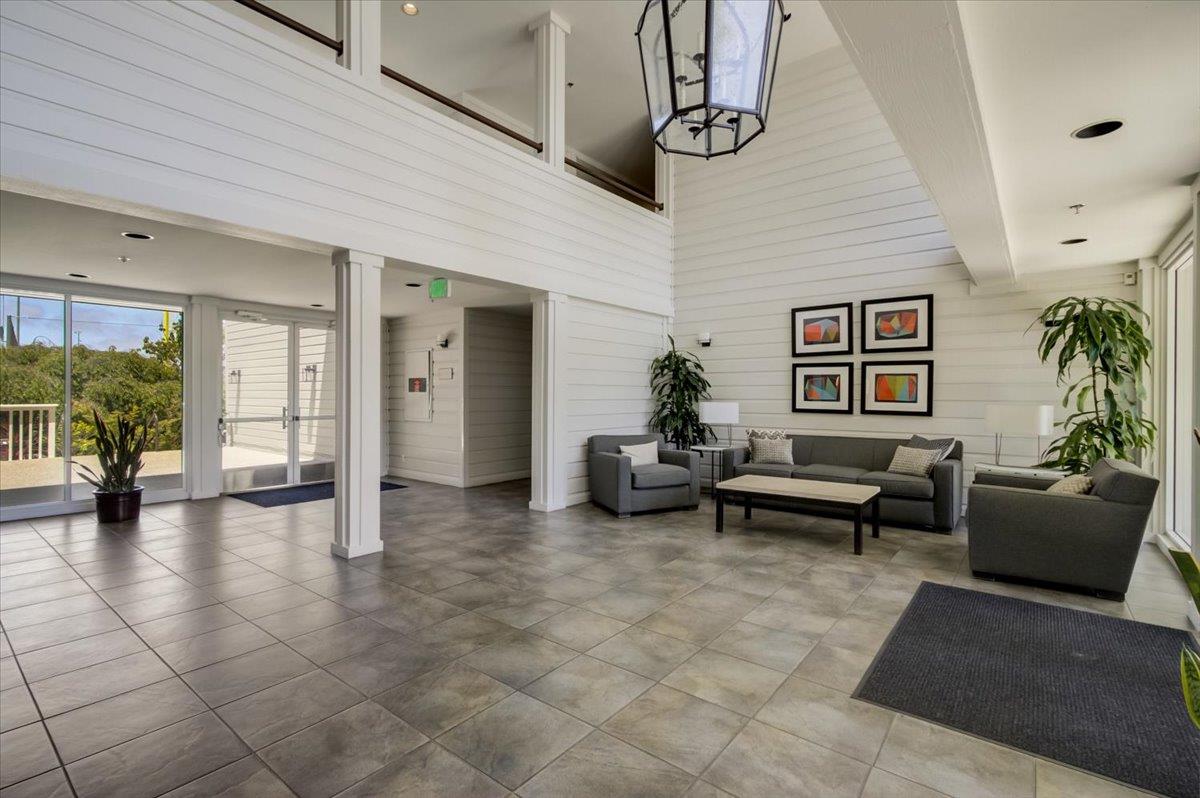 300 Murchison Drive, Unit 311 Millbrae, CA 94030 - Photo 17 of 25 a living room with furniture and wooden floor