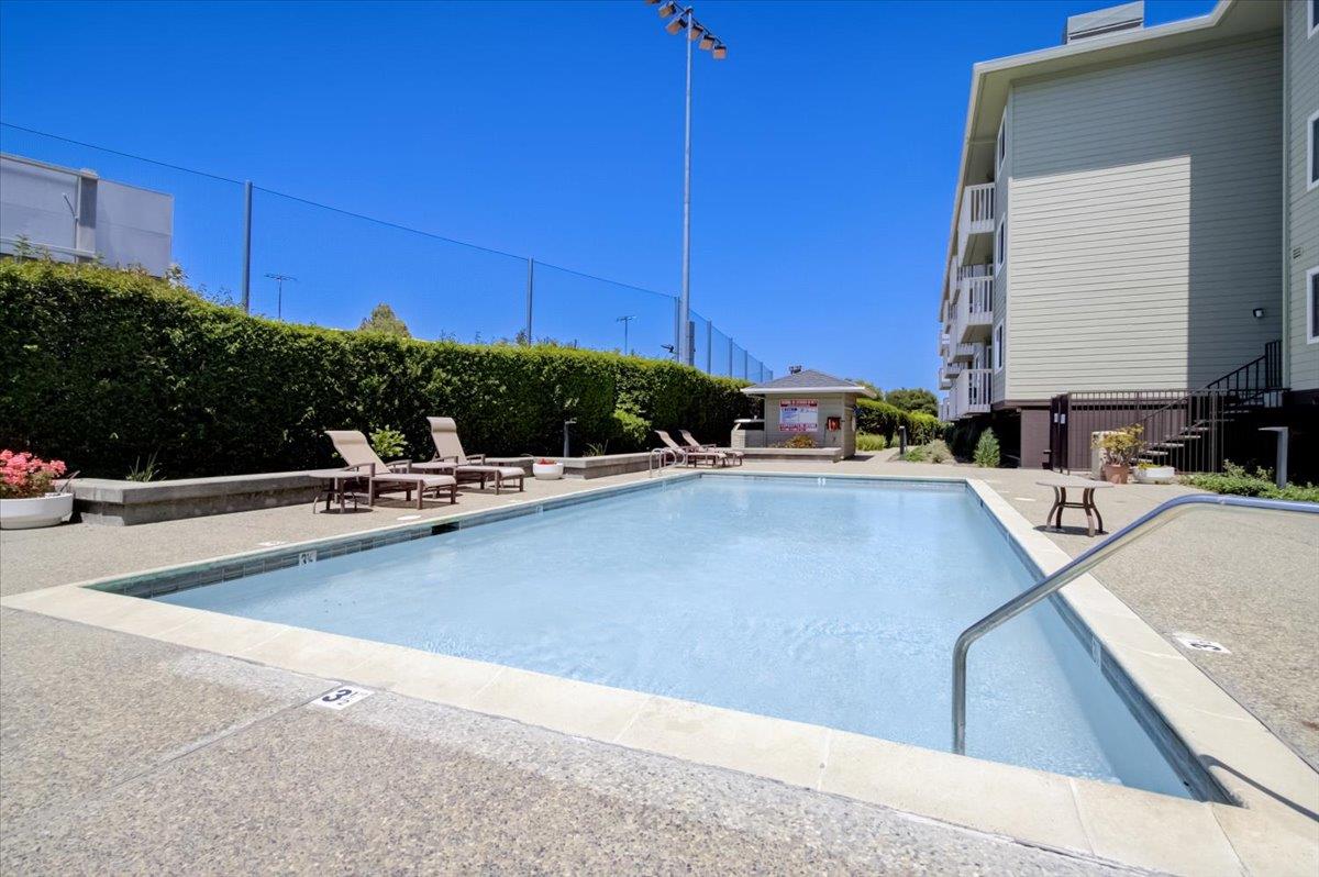 300 Murchison Drive, Unit 311 Millbrae, CA 94030 - Photo 18 of 25 a view of a kitchen with kitchen island a sink a counter top space and furniture